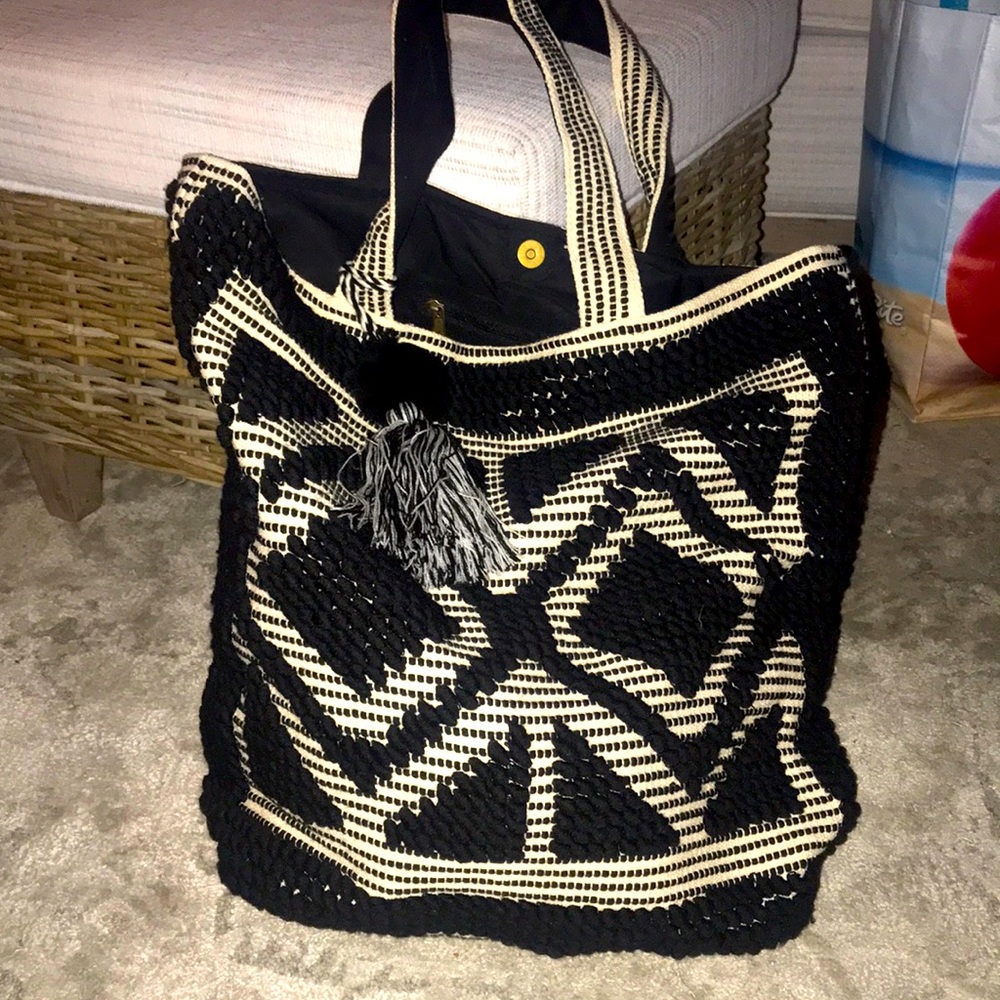 Large black and cream bag with tassel
